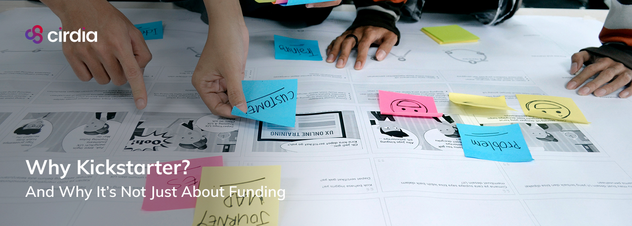 Cirdia team collaborating around a whiteboard with sticky notes and design sketches